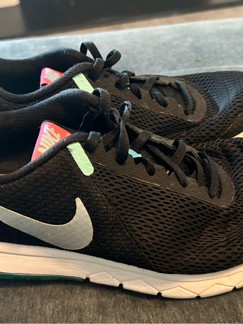 Nike Women’s Black Mesh Running Shoes with Mint and Coral Accents